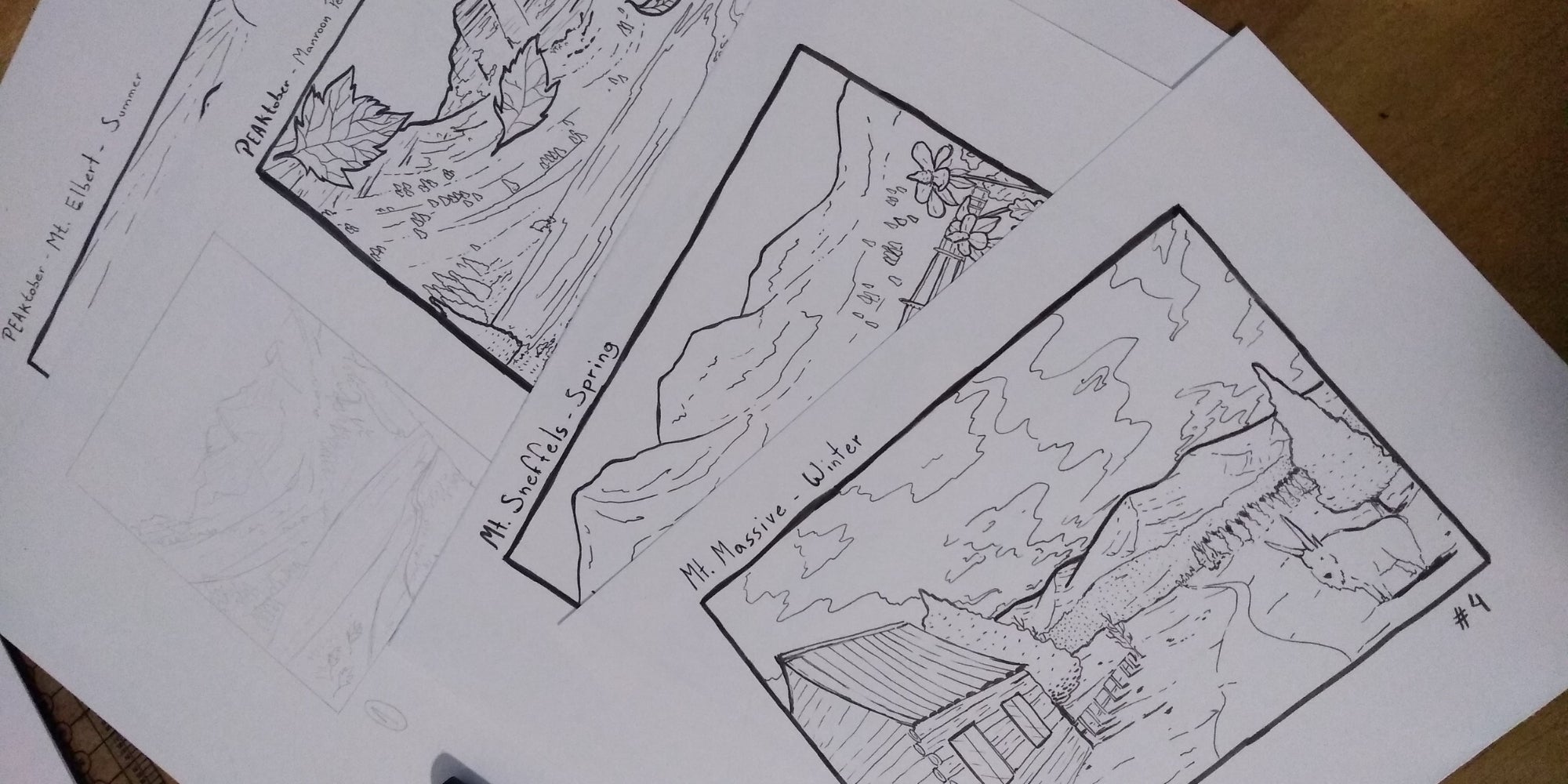 Three framed ink sketches of mountain landscapes on white paper, labeled "Mt. Elbert - Summer," "Mt. Sneffels - Spring," and "Mt. Massive - Winter".